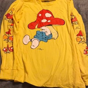 Yellow long sleeve top.